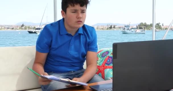 Teenage Boy Studying Yacht Deck Online Learning Distance Learning Kids — стоковое видео