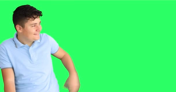 Happy Young Boy Smiling Pointing Green Screen — Stock Video