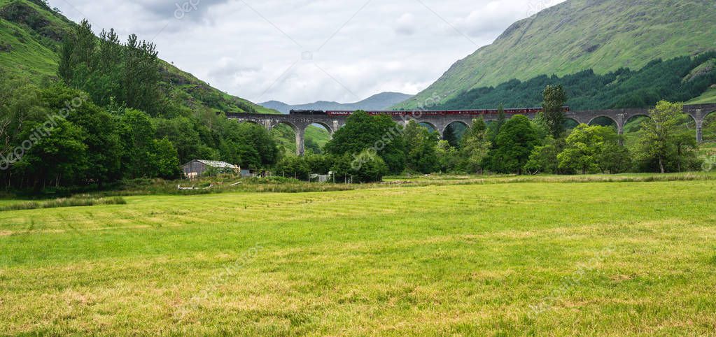 Glenfinnan Viaduct, tourist attraction featured in popular film about young wizard, Scotland, UK