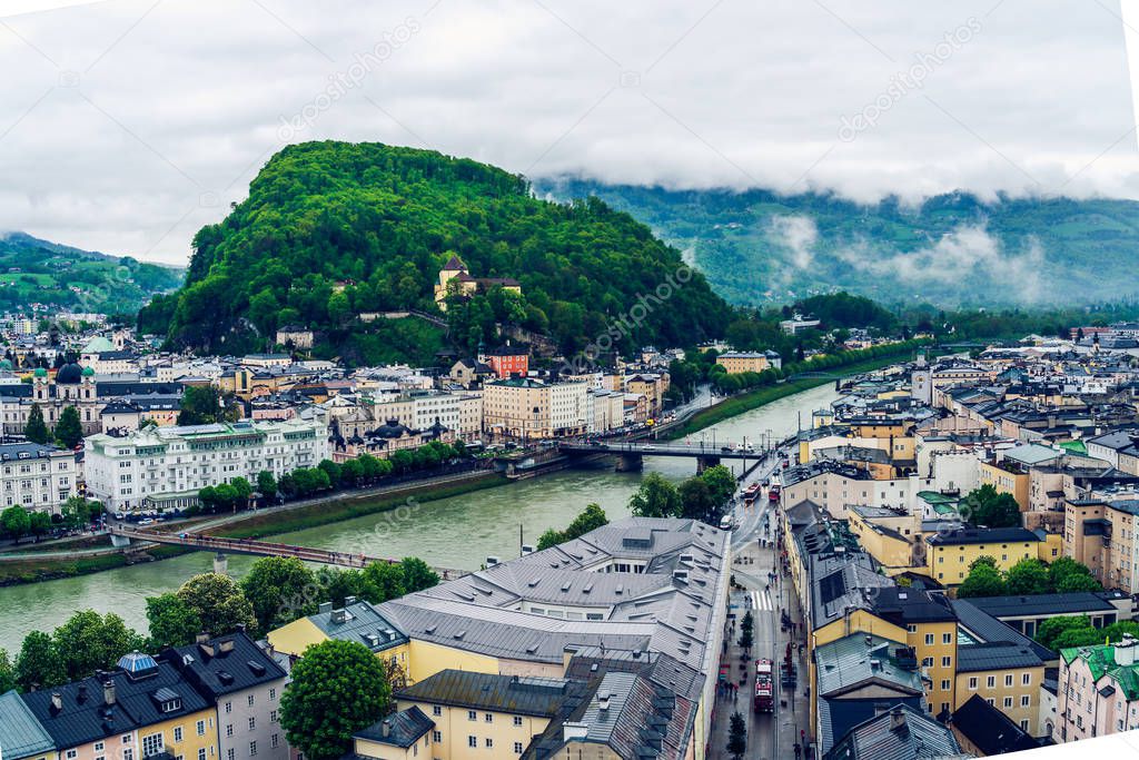 Salzburg Panorama on a gloomy and misty day. Austrian alps regio