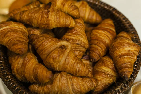 Bakery.Stack of fresh bakery croissants.