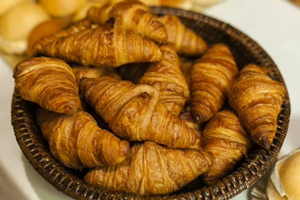 Bakery.Stack of fresh bakery croissants.