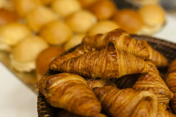 Bakery.Stack of fresh bakery croissants.