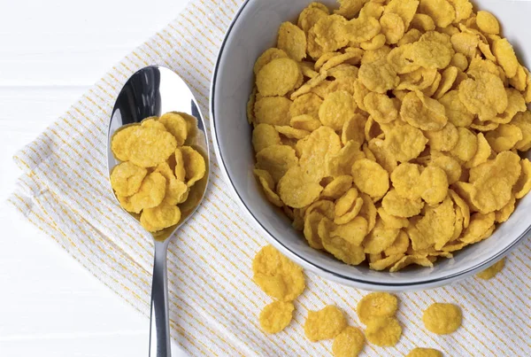 Corn Flakes at the white wooden table. — Stock Photo, Image