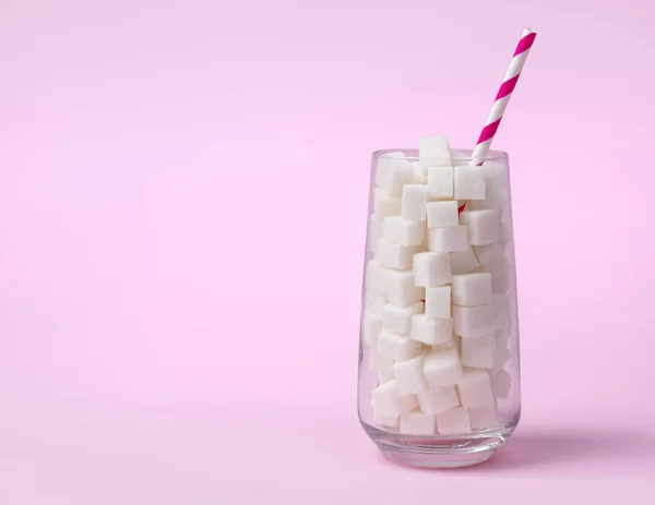 Glass full of sugar cubes. Unhealthy food concept. — Stock Photo, Image