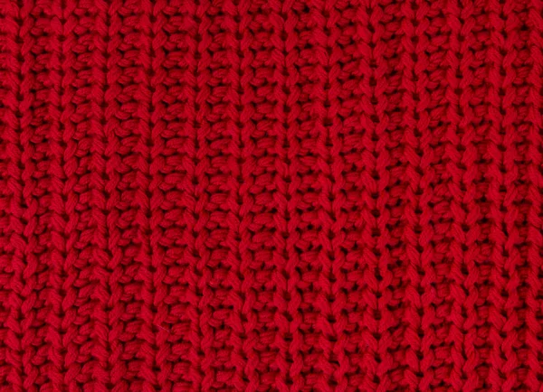 Struktura červené pletené látky zblízka. Vlněné pleteniny — Stock fotografie