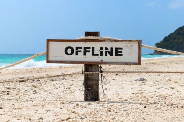 Old wooden sign with text offline on tropical beach clipart