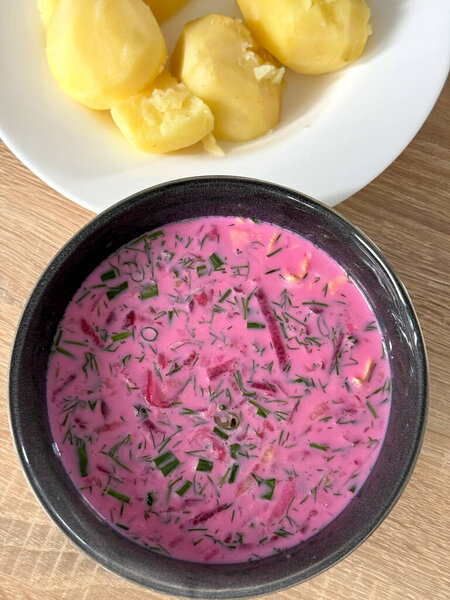 Kholodnik, cold beetroot soup with kefir and hot boiled potatoes. Slavic cuisine