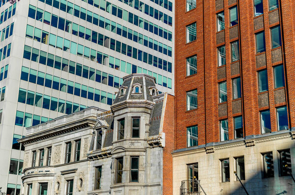 Old and new houses with huge windows in Montreal downtown, Canada.