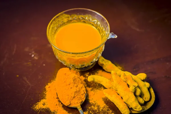 Tea of turmeric, Curcuma longa with its powder