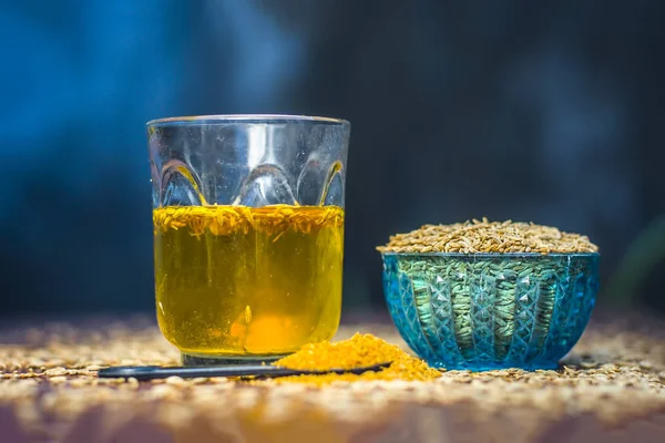 Cumin Seeds Its Powder Its Extracted Water Wooden Surface — Stock Photo, Image