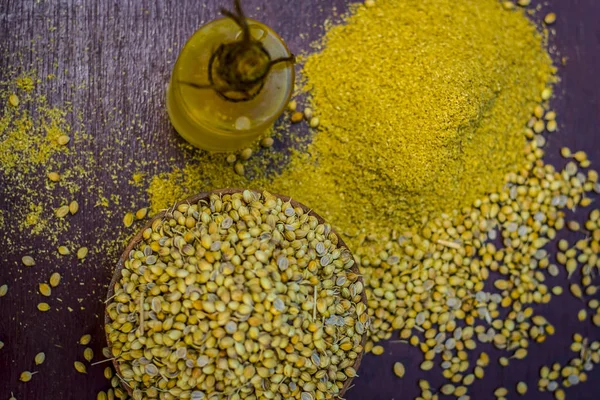 Coriander oil with dried coriander seeds in a clay bowl