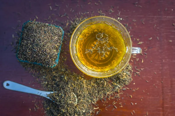 Sementes Cominho Preto Seu Chá Superfície Madeira — Fotografia de Stock