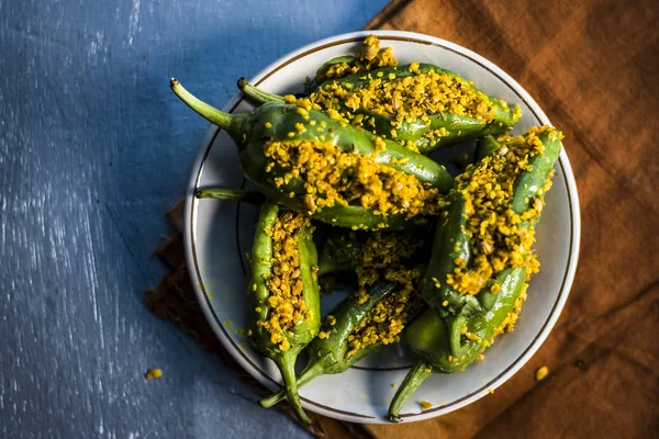 Green chilli peppers marinated in mustard seeds and mustard oil.