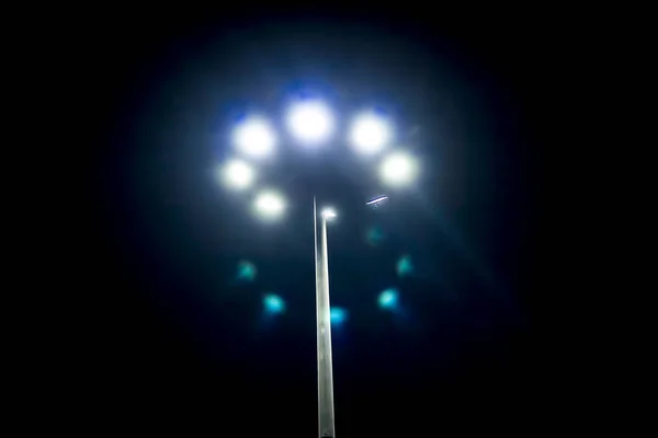 Close up view of street lights on dark sky background