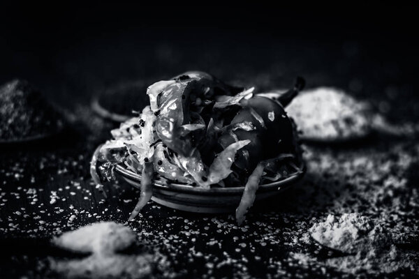 Traditional Indian cabbage pickle with spices on table