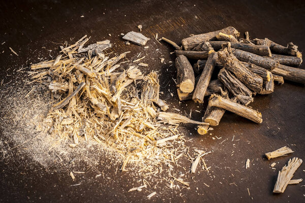 Ayurvedic licorice roots on dark wooden table