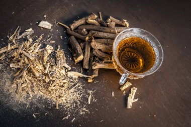 Ayurvedic herbal drink with Liquorice roots clipart
