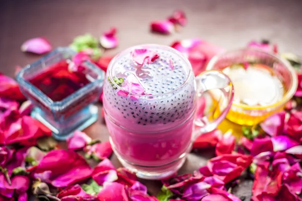 Traditional Indian cold drink Gulab Shake with rose petals