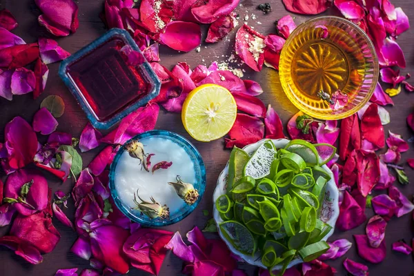 Top view of herbal face pack with aloe vera and honey decorating rose petals