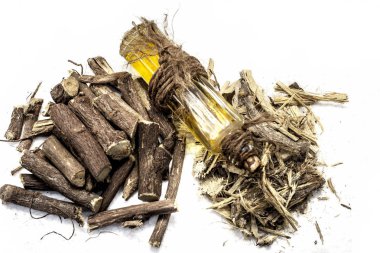 Ayurvedic herb Liquorice root,Licorice root, Mulethi or Glycyrrhiza glabra root and its powder with its oil for detoxifying the body, soothing spasms, easing menstrual cramps, raising blood pressure. clipart