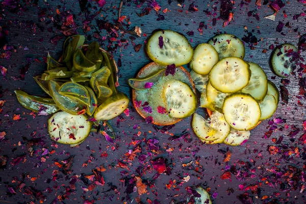 Close up of cucumber and Aloe Vera slices with rose petals