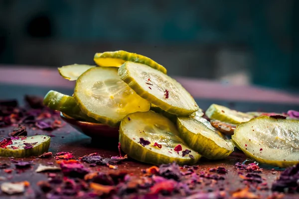 Cucumber and aloe vera slices with dry rose petals