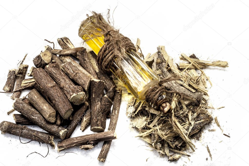 Ayurvedic herb Liquorice root,Licorice root, Mulethi or Glycyrrhiza glabra root and its powder with its oil for detoxifying the body, soothing spasms, easing menstrual cramps, raising blood pressure.