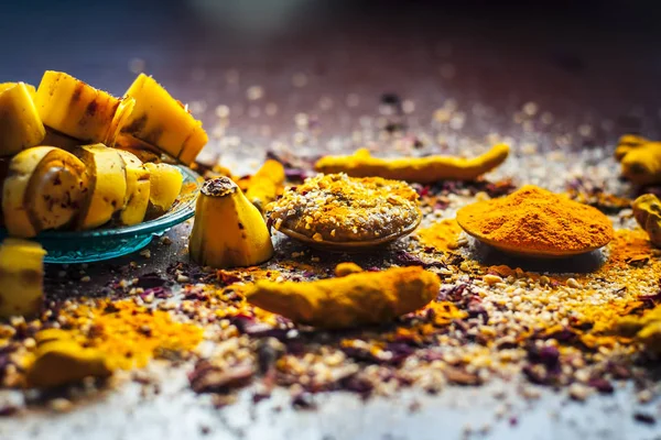 Banana face pack with turmeric powder and rose petals