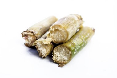 Close up of raw sugarcane on white background clipart