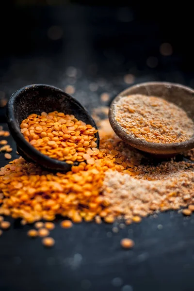 Close up of lentils beans with powder in clay bowls