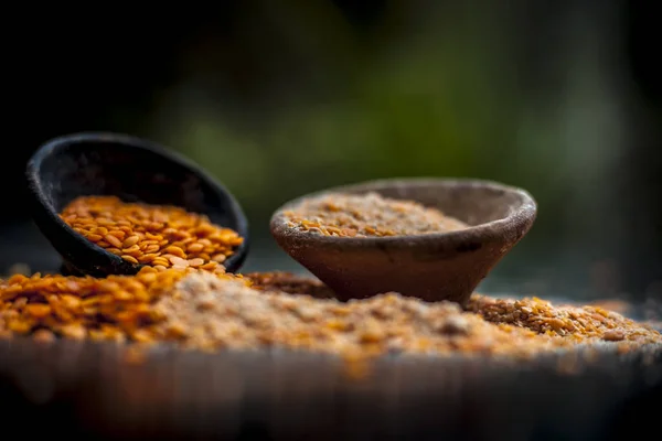 Close up of lentils beans with powder in clay bowls