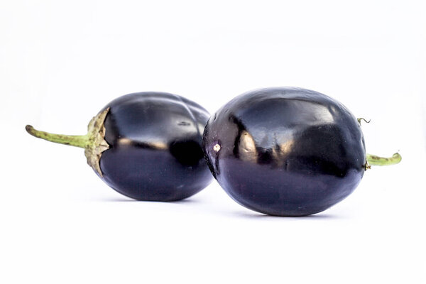 Close up of fresh organic egg plant or bringal or Aubergines or brinjal or baingan or eggplant isolated on white.