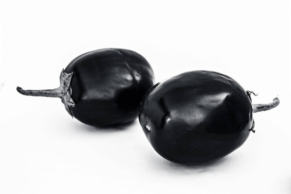 Close up of fresh organic egg plant or bringal or Aubergines or brinjal or baingan or eggplant isolated on white.