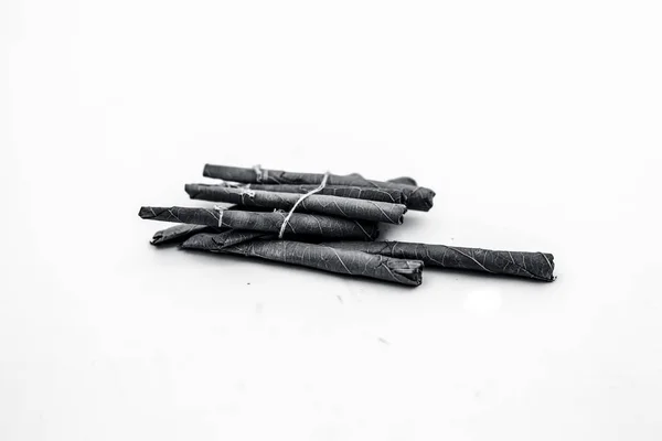 Close up of bidi or thin cigar or small cigarette isolated on white. — Stock Image Close Bidi Thin Cigar Small Cigarette Isolated White Stock Picture