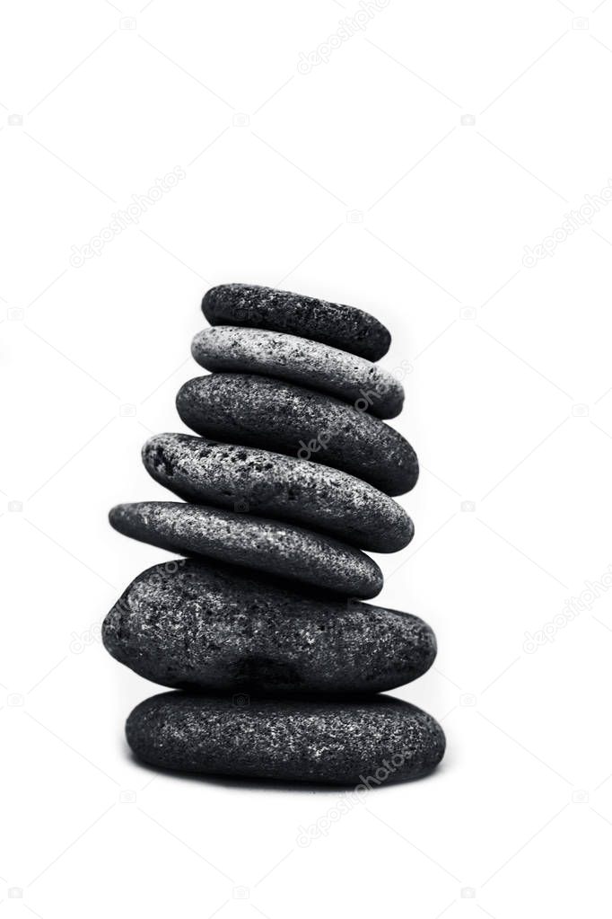 A bunch of pebbles or small stones on each other isolated on white.