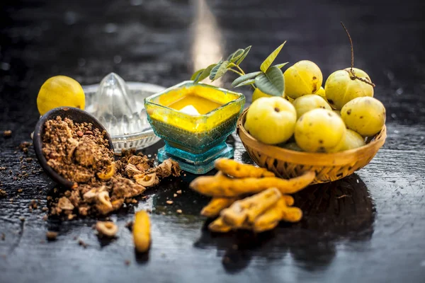 Close Indian Gooseberry Amla Turmeric Lemon Juice Wooden Surface Glass — Stock Photo, Image