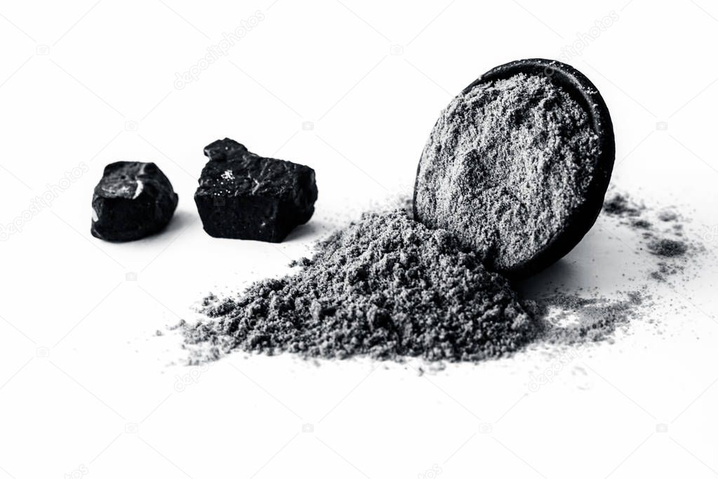 Raw hing or asofoetida or devil's dung isolated on white with its power also.