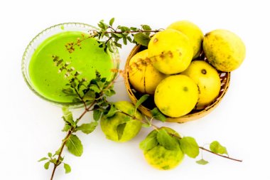 Lemon face pack isolated on white i.e. lime juice well mixed with tulsi or holy basil's juice.Used for the treatment or to remove dirt,dust and other impurities. clipart