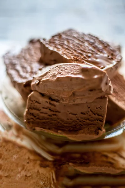 Close up of glass dish full of Chocolate chip ice cream.