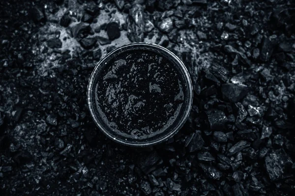 Close Activated Charcoal Glass Bowl Wooden Surface Some Raw Powder — Stock Photo, Image