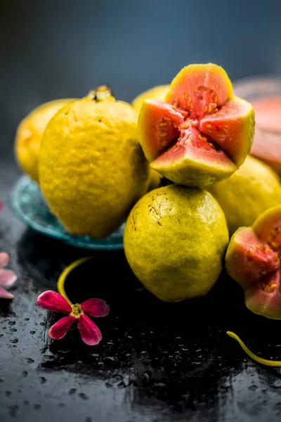 Skin whitening remedy/treatment on the black shiny surface consisting of guava pulp and honey. Also used in the spa as a face mask.