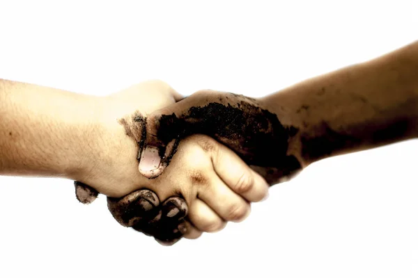 White and black people shaking hands
