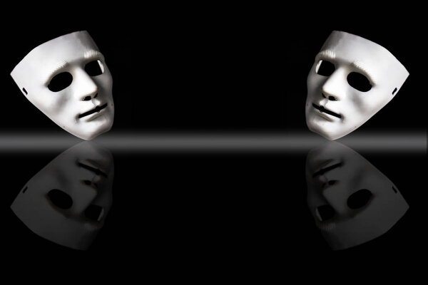 White-colored plastic face masks on black background 
