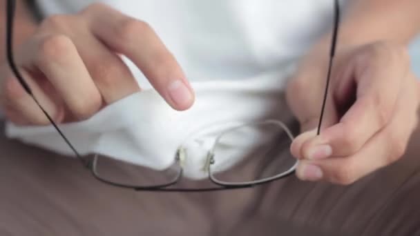 Close Shot Male Hands Cleaning Black Colored Eyeglasses His White — Stock Video