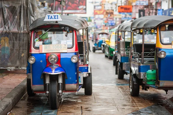 BANGKOK, THAILAND - 03. MAY 2018. Thailand tuk tuk taxi driving tourists around the city street. Auto rickshaw is traditional motorized vehicles called tuk-tuk. Day editorial shot