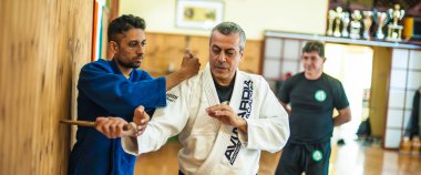 BELGRADE, SERBIA - 11. OCTOBER 2018. Kapap instructor Avi Nardia demonstrates martial arts self defense knife threat disarming technique. Weapon retention and disarm. KAPAP SELF DEFENSE SEMINAR