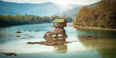 BAJNA BASTA, SERBIA - 20. OCTOBER 2018. Beautiful lonely house on the river Drina. Day editorial shot clipart