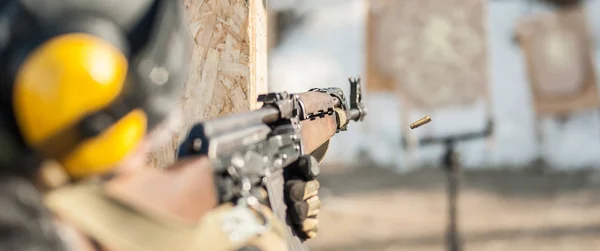 Special forces soldier in action, shooting from rifle machine gun — Stock Photo, Image