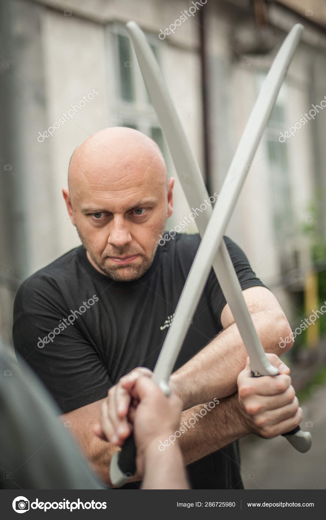 Escrima and kapap instructor demonstrates sticks fighting